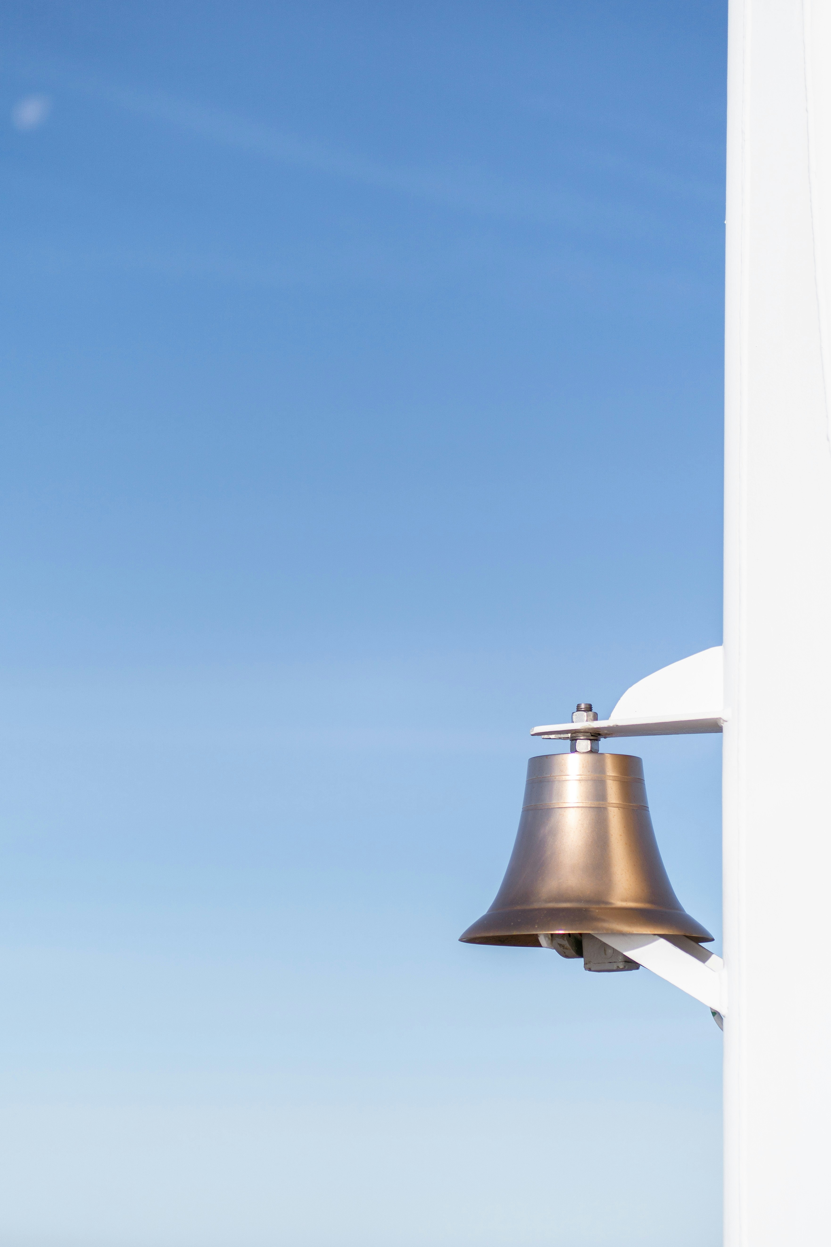 Ship's Bell against blue sky